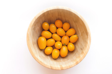 Kumquats or cumquats (Citrus japonica) isolated on white background