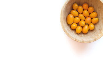 Kumquats or cumquats (Citrus japonica) isolated on white background