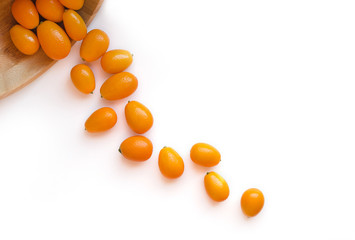 Kumquats or cumquats (Citrus japonica) isolated on white background
