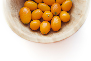 Kumquats or cumquats (Citrus japonica) isolated on white background