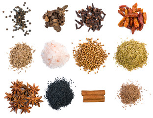Set of spices and food ingredients in heaps isolated on white background