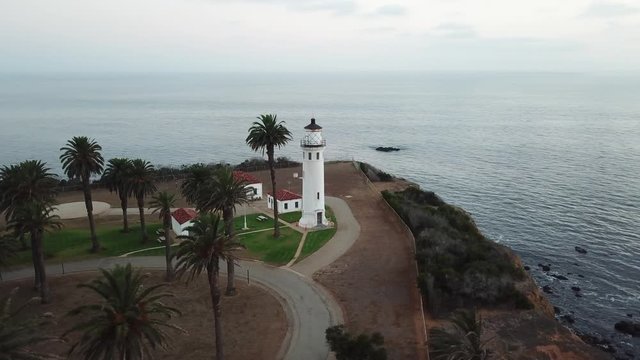 Light house on coast cliff aerial 