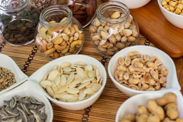 Various piles of mixed nuts and seeds
