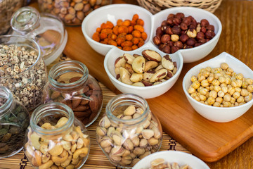 Various piles of mixed nuts and seeds