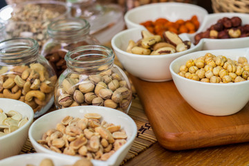 Various piles of mixed nuts and seeds