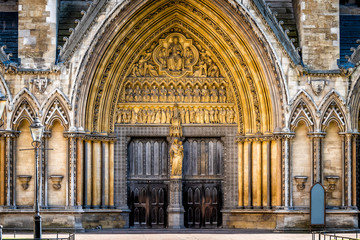 London, United Kingdom famous Westminster Abbey architecture closed large church doors facade exterior with nobody closeup entrance - obrazy, fototapety, plakaty