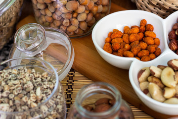 Various piles of mixed nuts and seeds