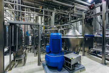Modern brewery production line. Beer filtration equipment and pump machinery