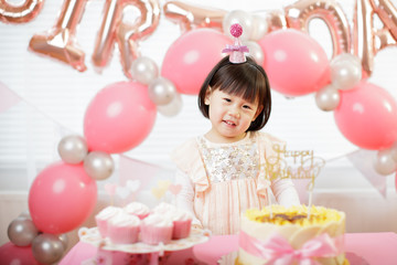toddler girl celebrating her third birthday at home
