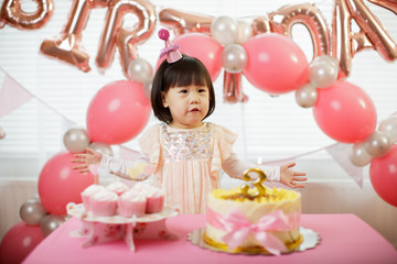 toddler girl celebrating her third birthday at home