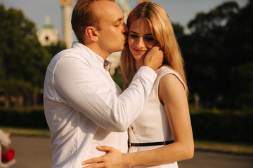 Obraz premium Happy couple walking around the city by the park Black and white clothes