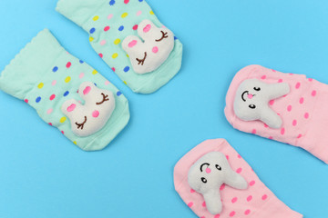 Obraz na płótnie Canvas banner baby clothes socks with a bunny 