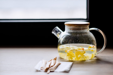 Tea ceremony. Incredibly delicious fruit tea. Glass teapot with natural fruits. Refreshing healthy natural tea.