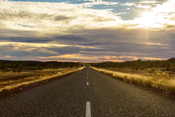 Fototapeta na wymiar straight road on the way to Ayers Rock , Lasseter highway , Northern Territory, Australia
