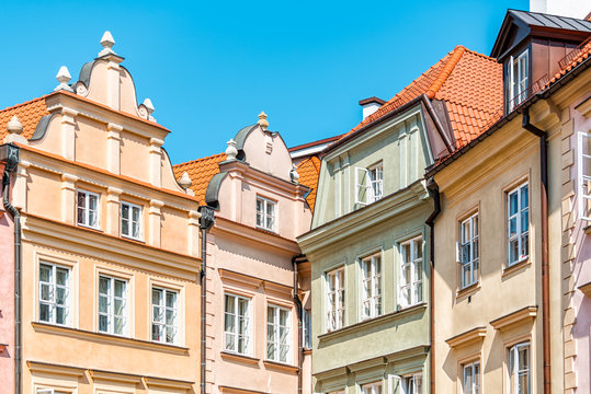 Warsaw, Poland old town square with historic street town architecture and multicolored pattern of pink and yellow vintage color buildings