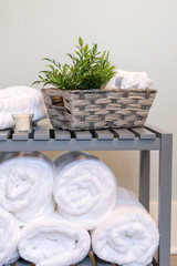 Fototapeta na wymiar Clean white towels rolled up in the bathroom