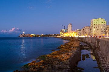 Fototapeta na wymiar The Havana skyline, the sea and El Morro castle at sunset