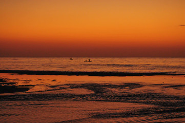 Fishing boats going out to sea during a beautiful sunrise in the Pacific Coast of Panama