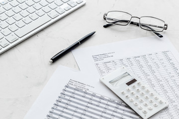 business accounter work with taxes calculation and keyboard on white office desk background