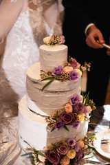 Wedding cake closeup at a real reception and the end of the party - Closeup