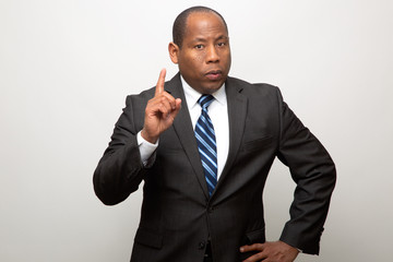 African American Business Man Pointing with Finger in Signal of Advice and Warning