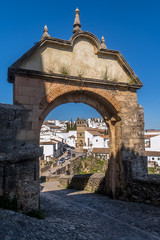 Fototapeta na wymiar Ronda Spain medieval hilltop town surrounded by walls and towers with famous bridge over gorge
