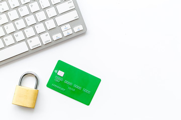 Data protection concept with credit card, locker and keyboard on white background top view mock up