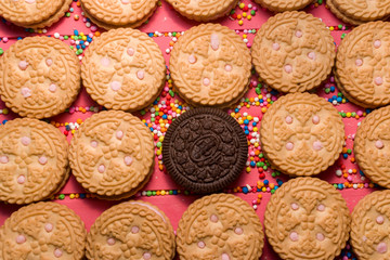 strawberry-flavored cream-filled cookies with chocolate-flavored cookies