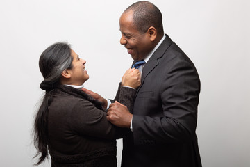 Happy Mixed Race Couple on Light Gray Background