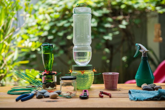 DIY Making Hummingbird Feeder In The Garden With Tools On The Wooden Bench