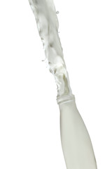 Fast Action Liquids Photography. Milk Splash Out Of The Bottle. Isolated Over White Background