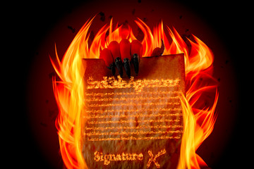 Pact to sell your soul to Lucifer, strike a Faustian bargain or deal with the devil concept theme with Satan holding in creepy ugly red hand with claws burning scroll with fiery text written in flames - obrazy, fototapety, plakaty