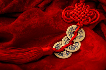 Feng shui or Chinese geomancy and traditional culture of Chine concept theme with gold coins tied...