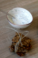 Gluten free seed crackers and lemony yoghurt sauce. Selective focus.