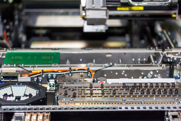 Close up inside automatic PCB LED SMT pick and place machine of high technology and accuracy for assembly or manufacturing electronic board