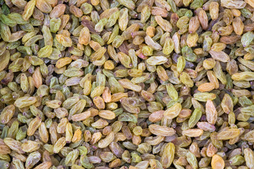 Mulitcolor dry grape heap close-up view in a chinese market, Chengdu, China