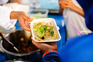Volunteers collaborated to provide food to beggars with compassion.
