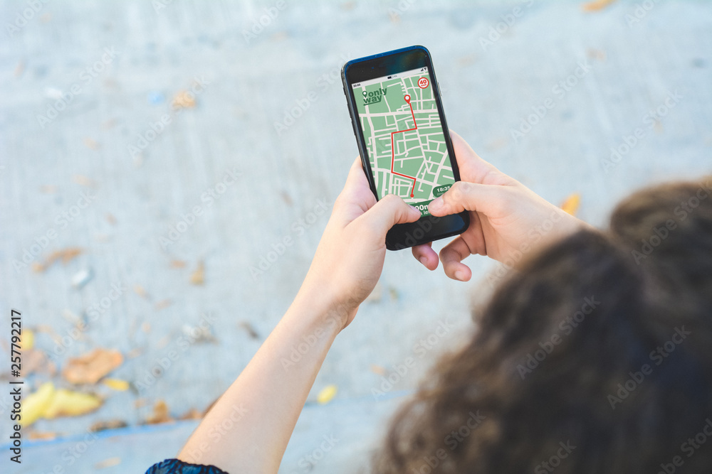 Poster woman using gps map navigation app with planned route