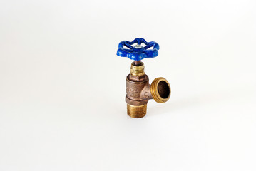 Closeup of outdoor water faucet or hose bib on a neutral BG.  Or, Hotwater Tank Drain.