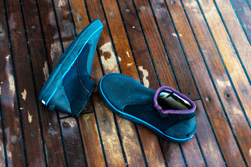 Special shoes for diving on a wooden background