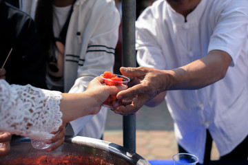 poverty concept : Help with feeding homeless people to alleviate hunger.