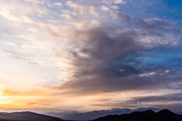 Snow Mountain Scenery of Bayinbrook Grassland in Xinjiang  ，when the sun goes down