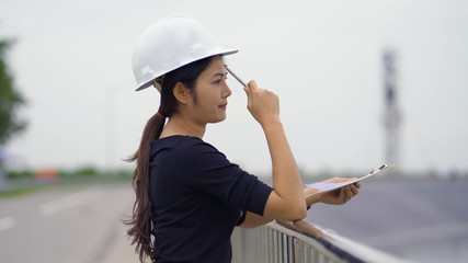 Asian female engineer checking the job.