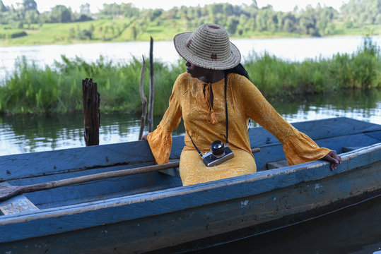 woman sitting in a boat in Kenya