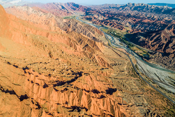 Xinjiang China. National Geopark Danxia Landform. China travel famous natural exotic landscape. Sandstone towers large canyon dry desert valley