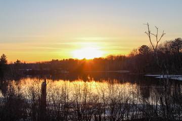 Obraz premium sunset over a river