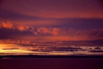 Naklejka na ściany i meble purple sunset, sunset after storm, fluffy pink clouds
