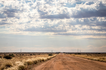 Dirt road and dramatic sky landscape