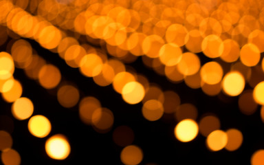 Gold glitter lights texture bokeh background Christmas. defocused