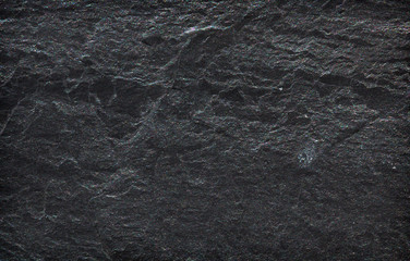 Fototapeta na wymiar Dark grey black slate stone background or texture
